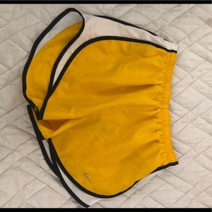 Yellow white and black nike shorts